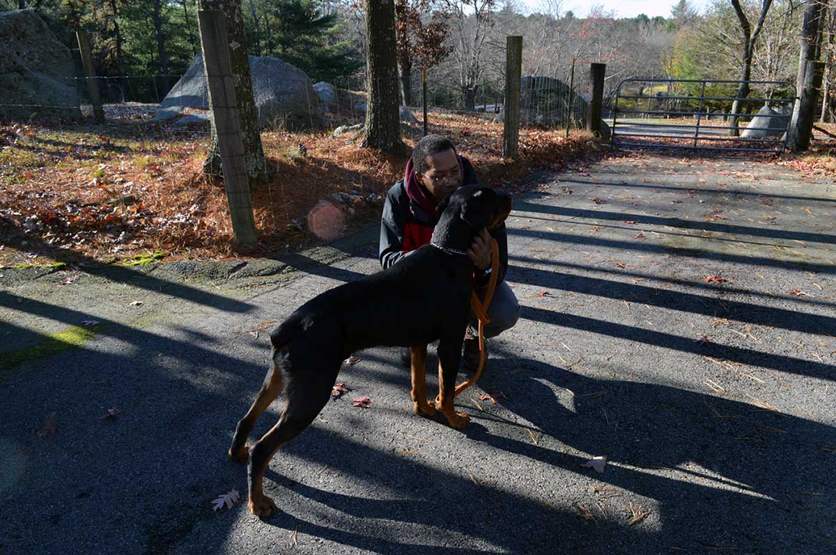 Shawn petting Rottweiler